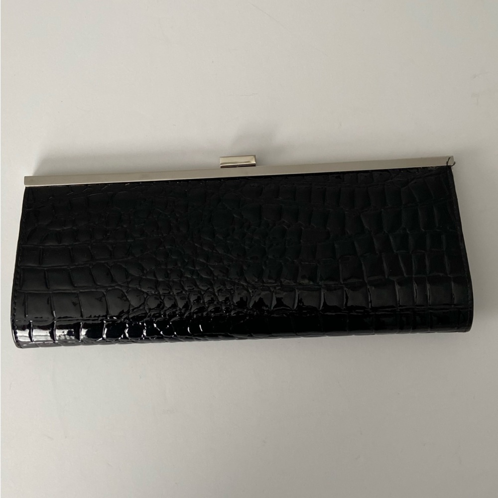 Faux croc patent clutch.